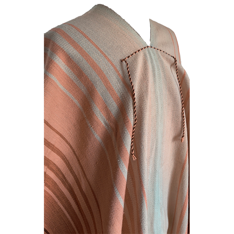 Close-up of Angostura Argollas poncho with beige, rose and brown natural tones