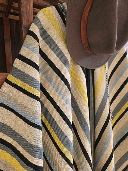 Close-up of Colomé Listado wool poncho woven on a criollo loom
