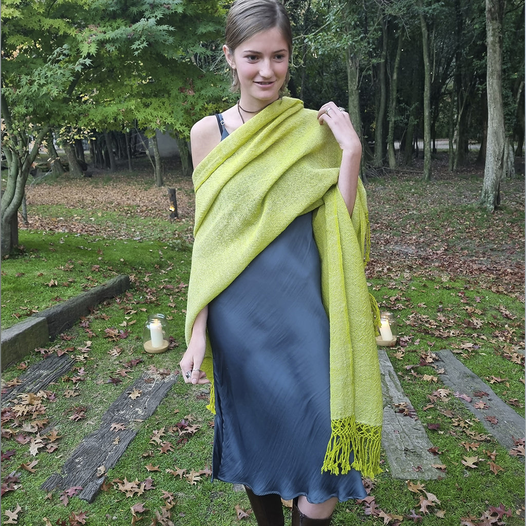 Lightweight wool ruana with neon green palette and soft texture