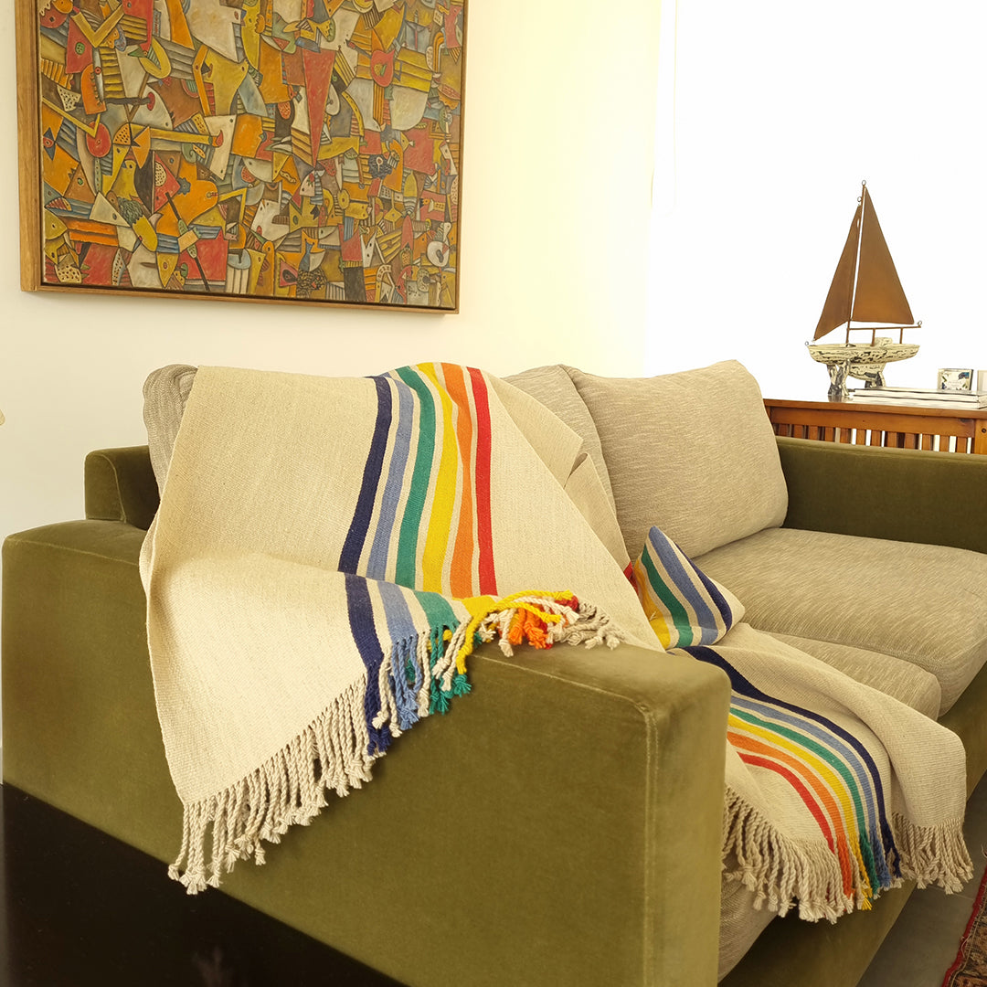 Rainbow Tradition Poncho displayed as wearable artisan textile art