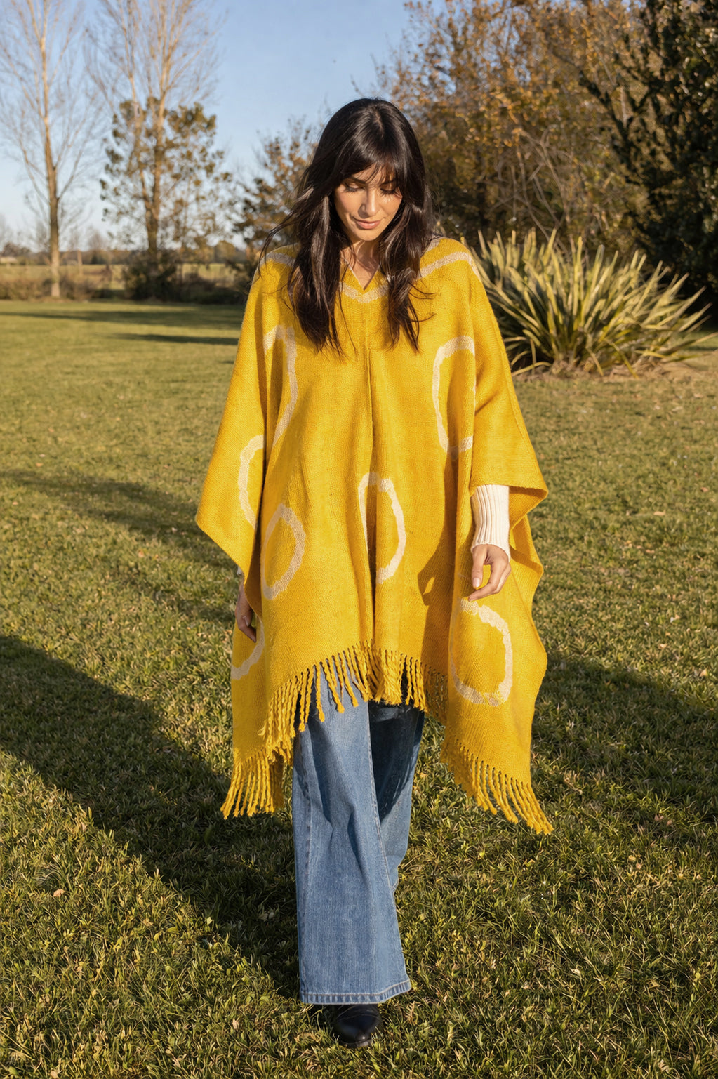 Yellow natural dyed Anzulón poncho made with plangit tie-dye technique
