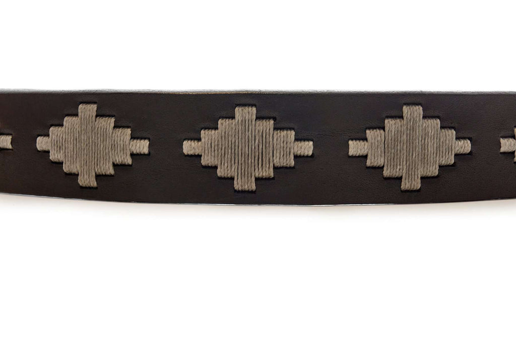 Dark leather polo belt with Inca-inspired geometric detail and metal buckle
