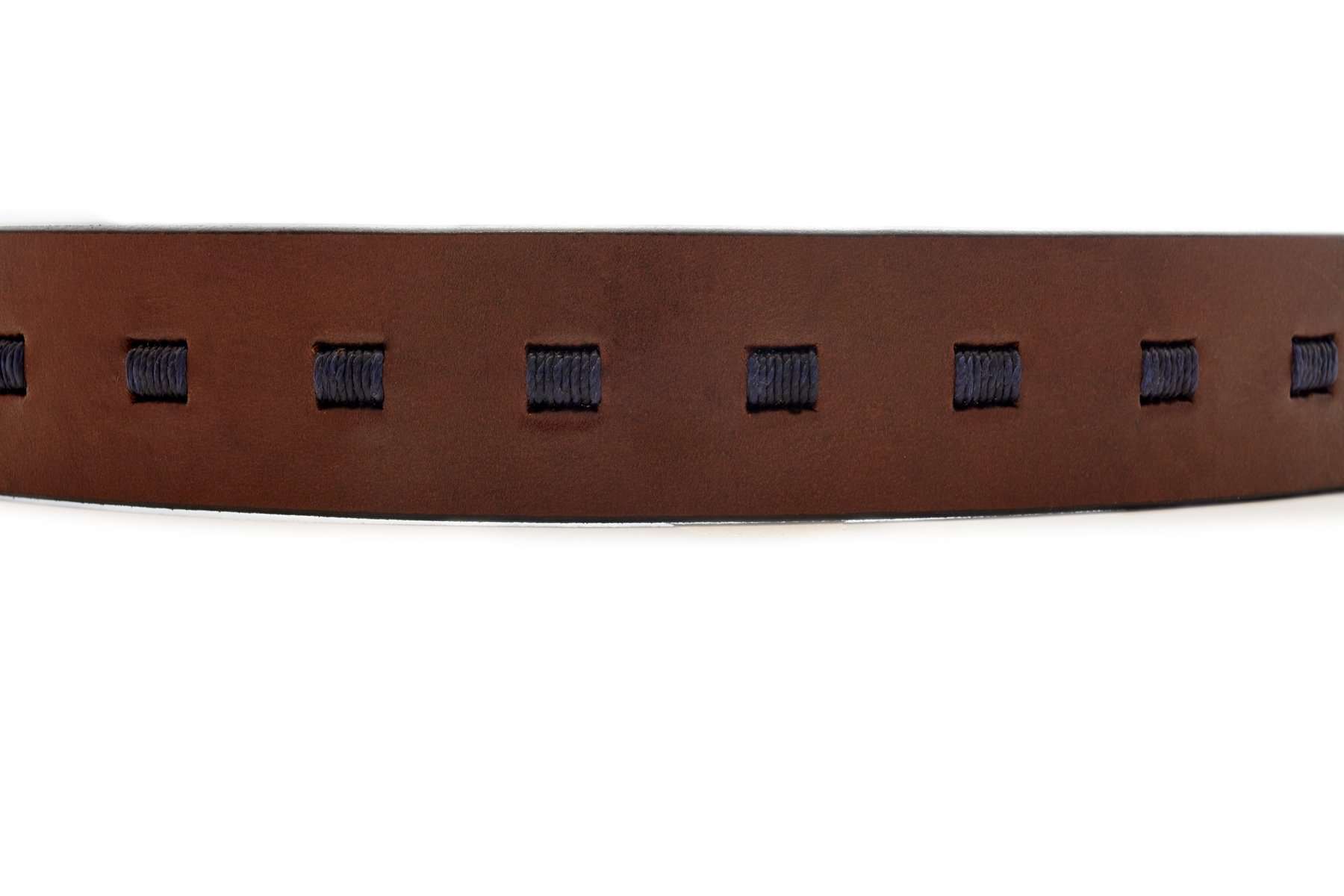 Warm brown leather polo belt with small navy stitched accents and metal buckle
